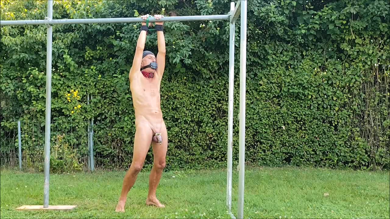 Naked Pathetic Slave Exposed In Penis Cage During Outdoor Party