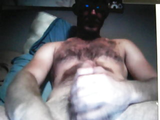 Hairy  bear jerking his huge cock on cam