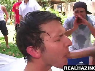 Frat boy hunk sucking and tugging on a cock outdoors