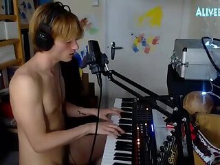 handsome dude plays music after masturbates and cums