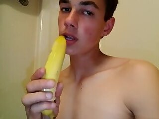 Twink fucks himself with a banana