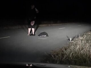 Exhibitionist in the road ripping off clothes and pissing