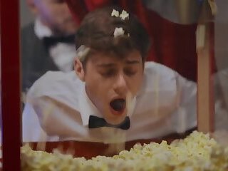 buttering his popcorn