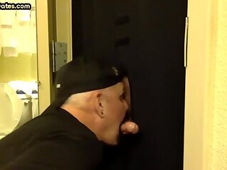 Dirty gay men sucks and jerks off cock in gloryhole