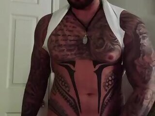 Tattoed muscle hunk jerking his 9 inch dick while dirty talking