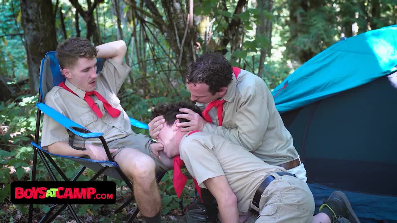 Boys At Camp - Two Scout Leaders Welcum The New Scout Boy At The Campsite With Passionate Th pic pic